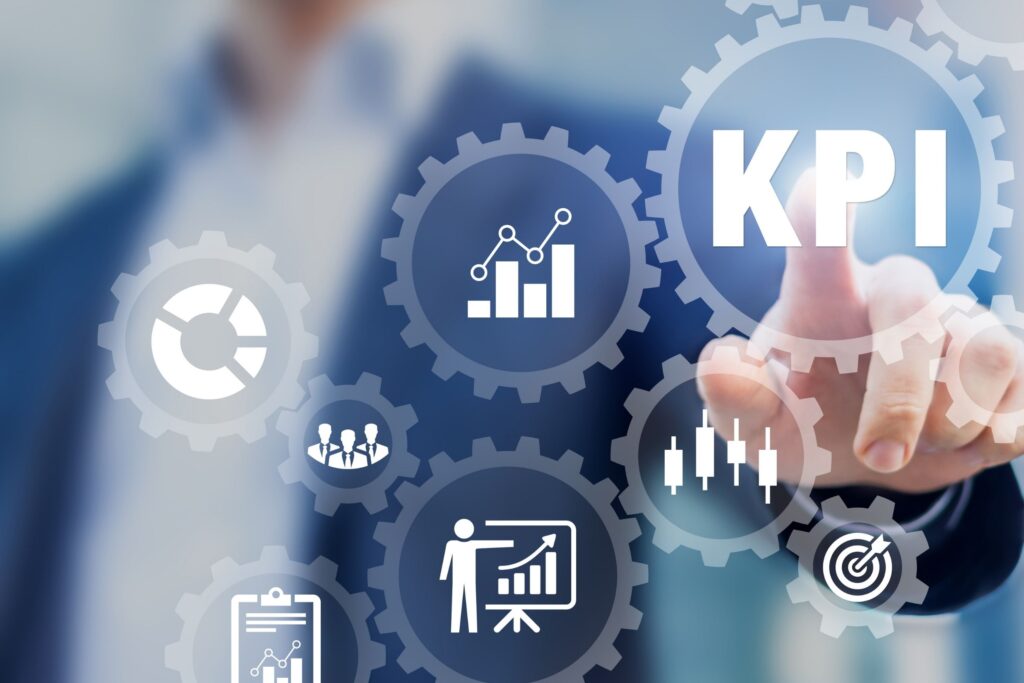 business man pushing KPI button, KPIs concept image