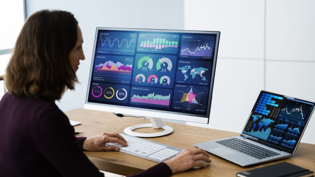 woman using her marketing dashboard on the computer to increase her income 10x