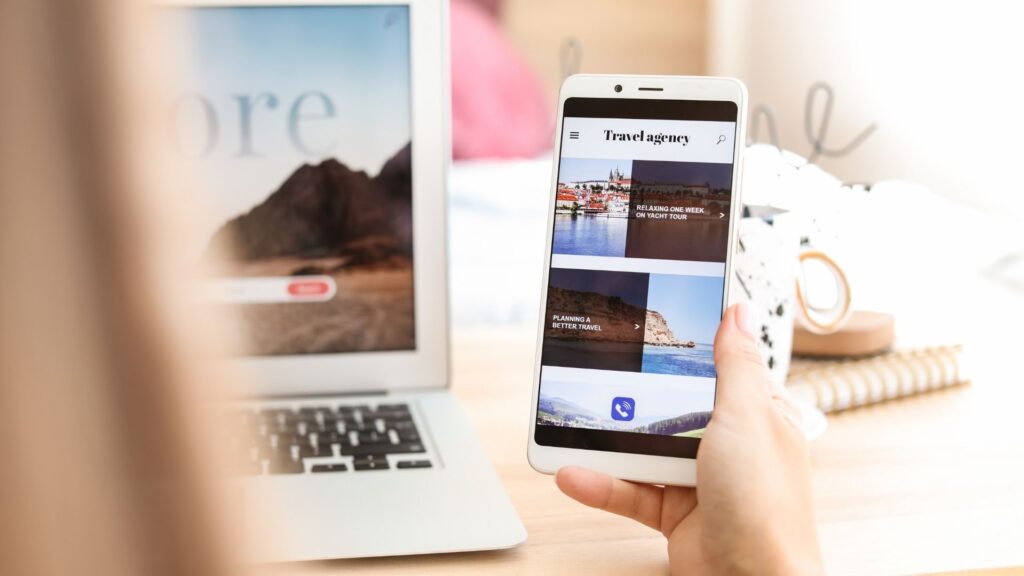 a woman is on a mobile optimized travel agency website on her smart phone device